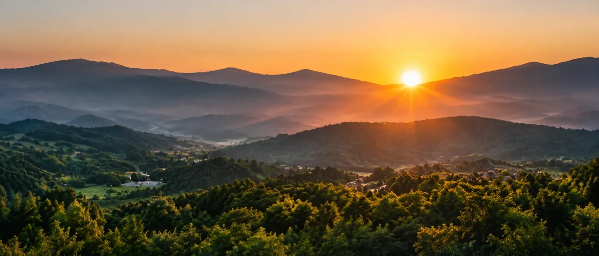 Sunrise over a green mountain landscape